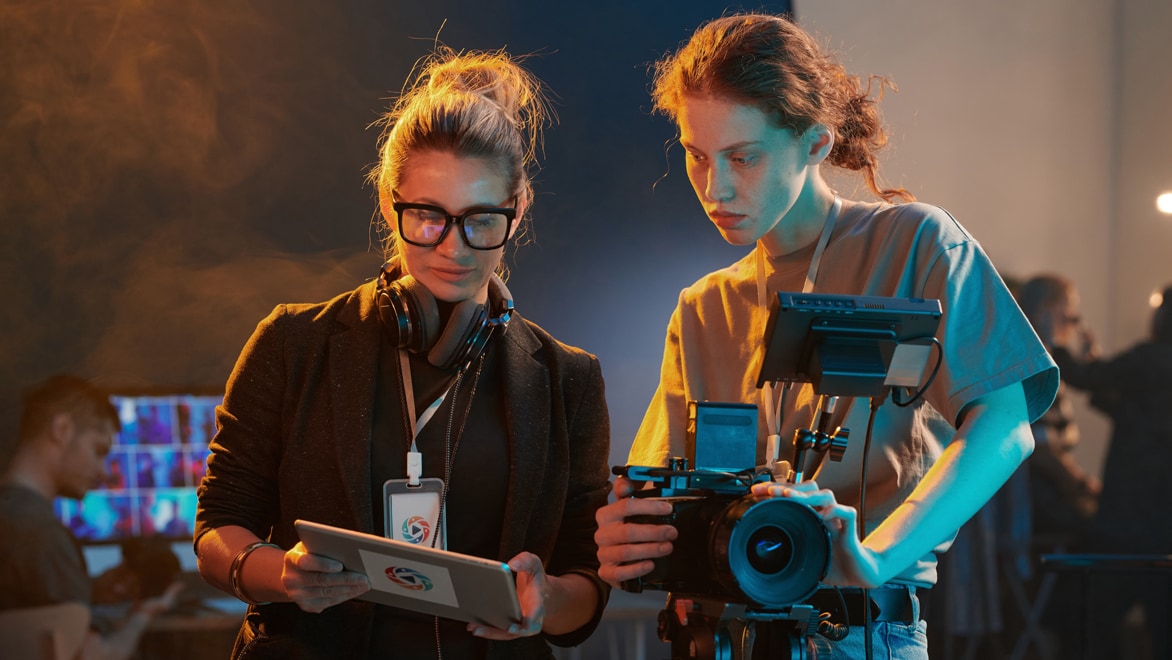 Filmmakers on-set reviewing footage