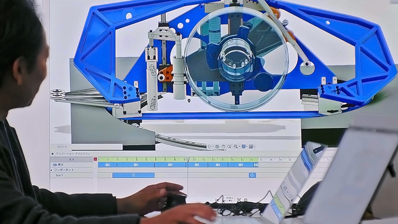 Features Professor Hirohito Hamane and students, teaching and studying design & manufacturing