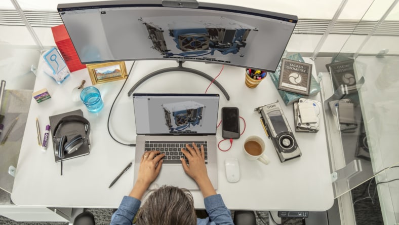 Image of people sitting in an auditorium posing for a selfie