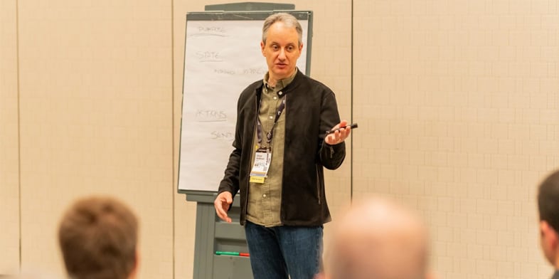 Autodesk VP & Chief Architect Oliver Goldman presenting in front of a group of employees.