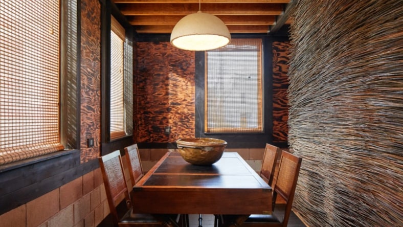 Two people looking at low-cost direct air capture system