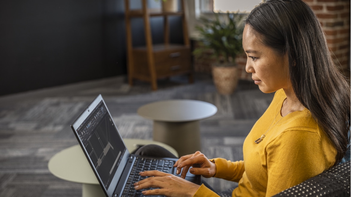 AutoCAD interface displayed on a laptop as a user reviews and refines design work.