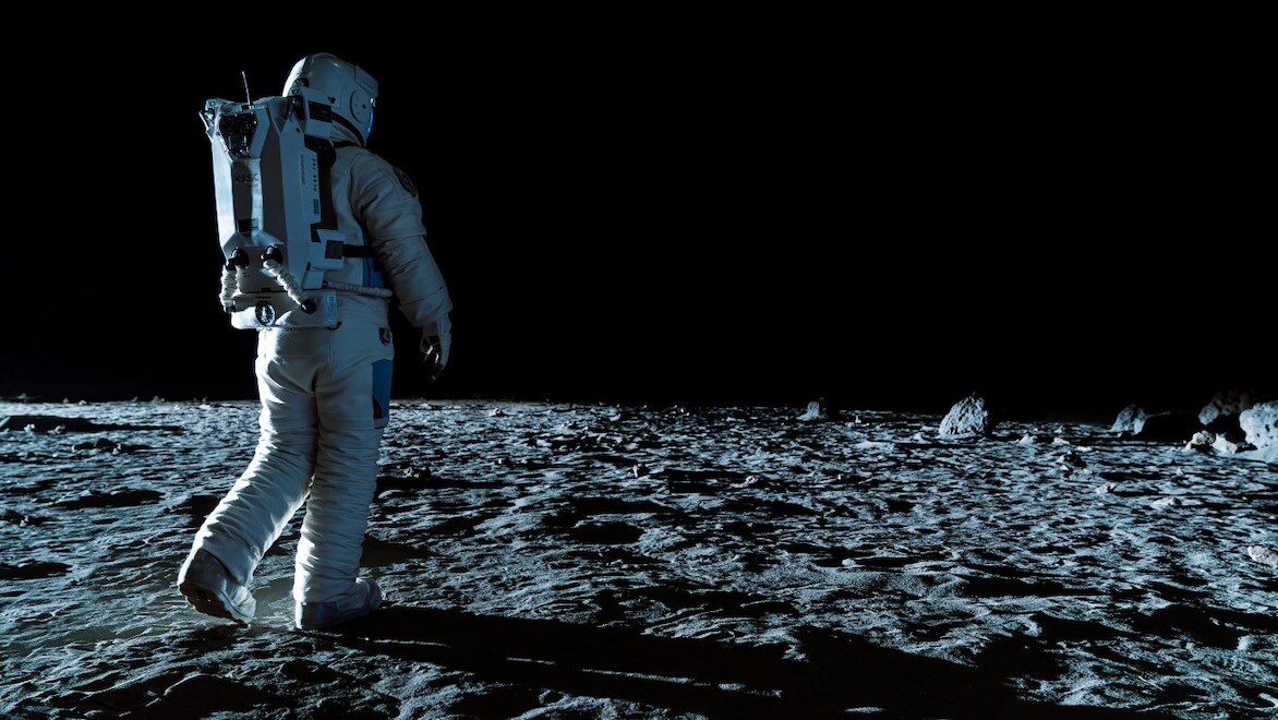 An astronaut walking on the moon.