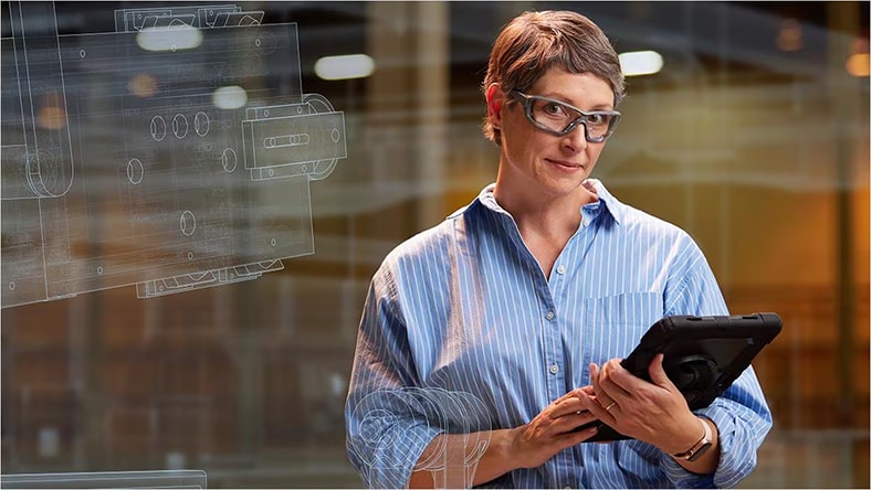 Production engineer holding tablet