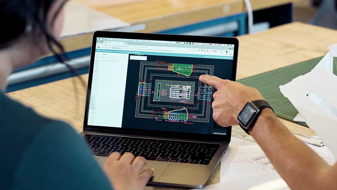 Architects working with AutoCAD to laser cut architectural models.