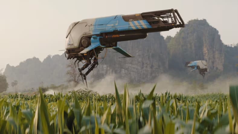 Still of small spacecraft over a field with mountains in the background.