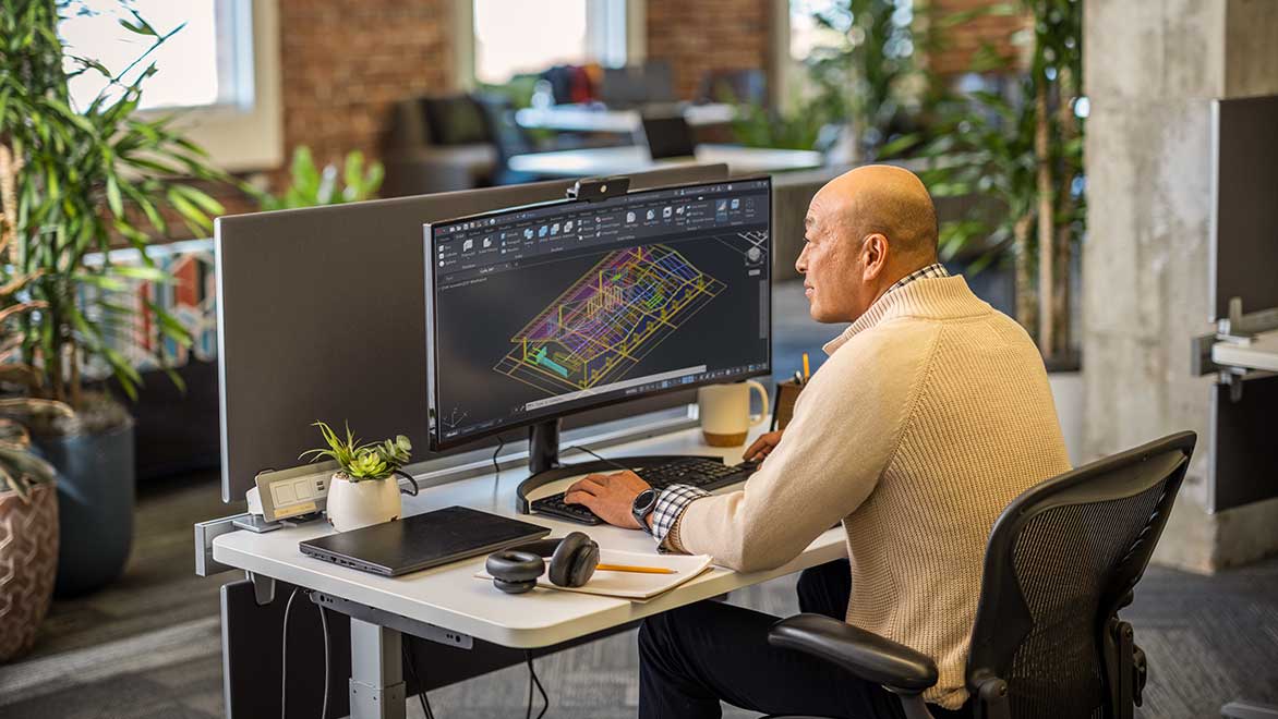 Man using AutoCAD in an office environment