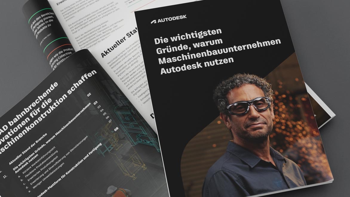 Designer and engineer standing in shop, looking at illustrated outline of machine CAD model 