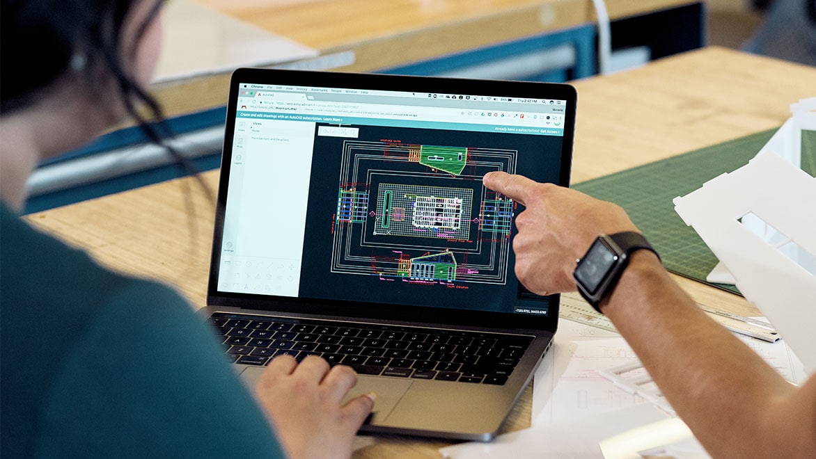 Architects working with AutoCAD to laser cut architectural models.