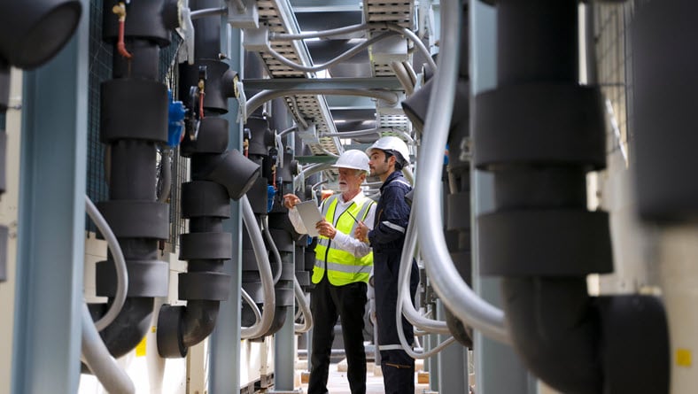 Manufacturing engineers working on line.