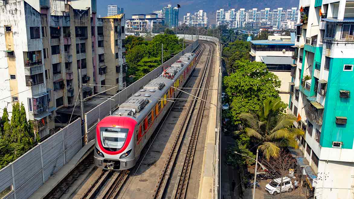 A mtero train passes through the residential apartment areas