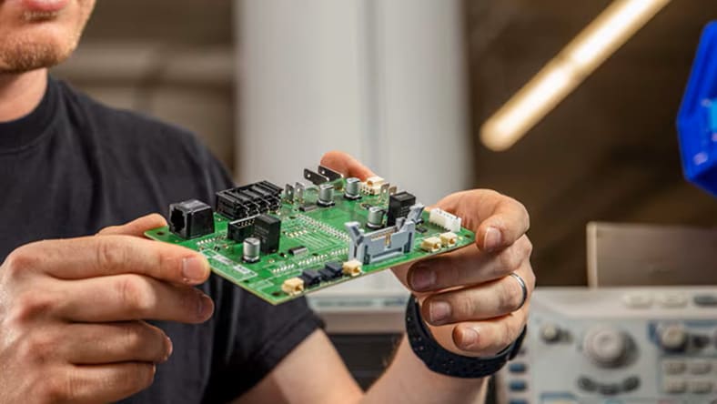 Man holding circuit board