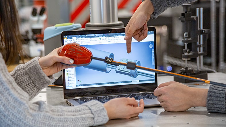 Two individuals working collaboratively on a design project