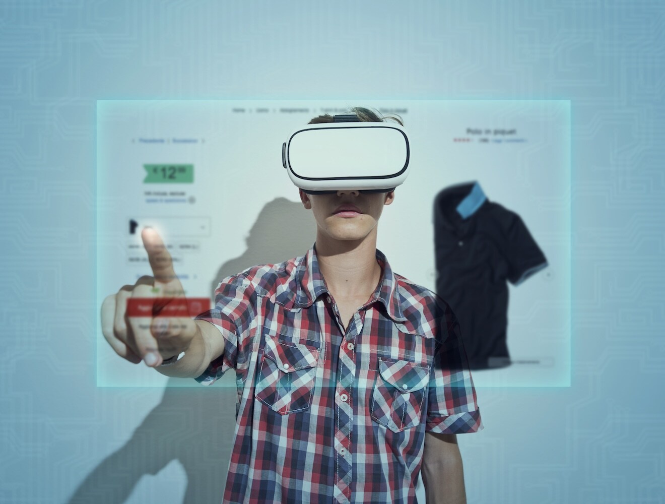 A boy wearing VR goggles browses clothing online.