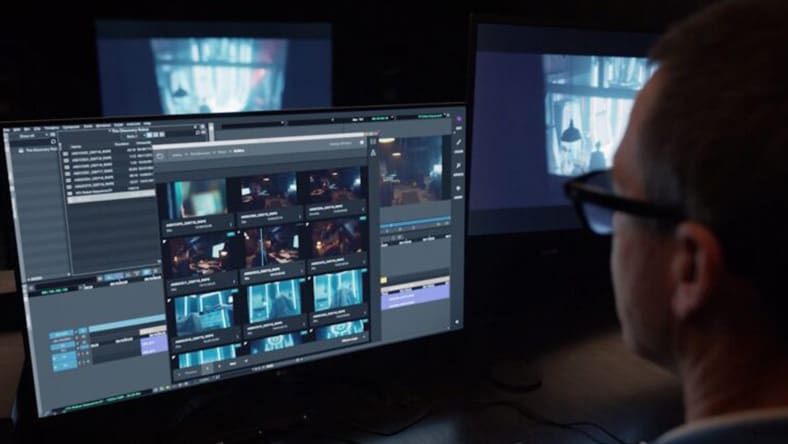 a person working on video editing software on a computer.