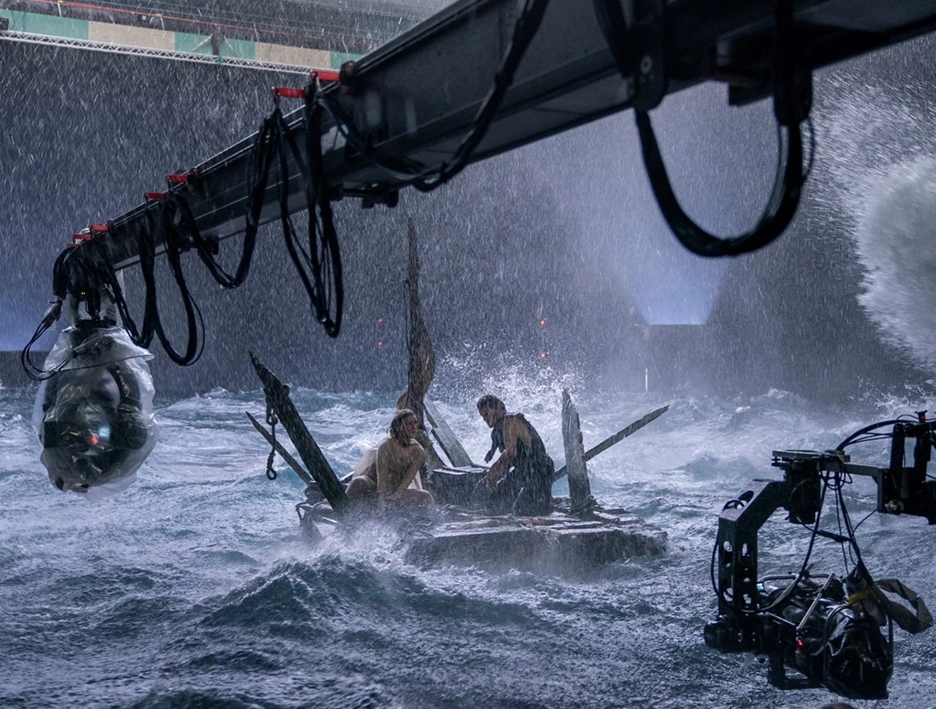Film set with two people on raft in turbulent water
