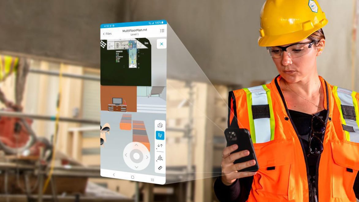 Construction worker using mobile app for jobsite workflows