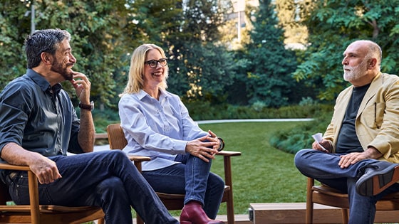 José Andrés sits outdoors with Alessandro Carloni and Erica Rivinoja, writers and directors of The Cat in the Hat, during a conversation. 