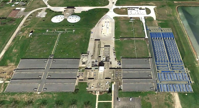 Aerial view of a water treatment plant and basins. Rendering.