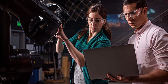 Two people working in the robotics lab at the Autodesk San Francisco Technology Center.  