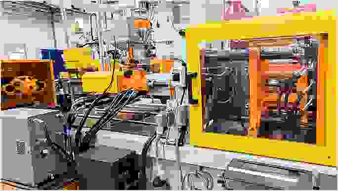 A technology laboratory with operating machinery integrated together via wires, cables, and cords.