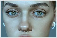 Muotokuva nuoresta naisesta, jolla on nenärengas ja vihreät silmät