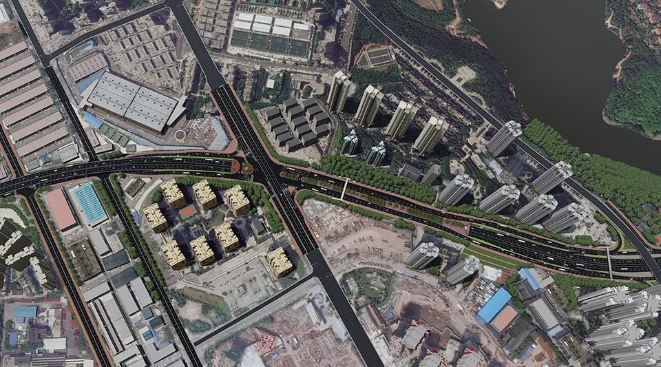 Luftaufnahme eines städtischen Bereichs mit Autobahnen, Hochhäusern und einem Gewässer
