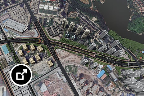Luchtfoto van een stedelijk gebied met snelwegen, hoogbouw en een watermassa