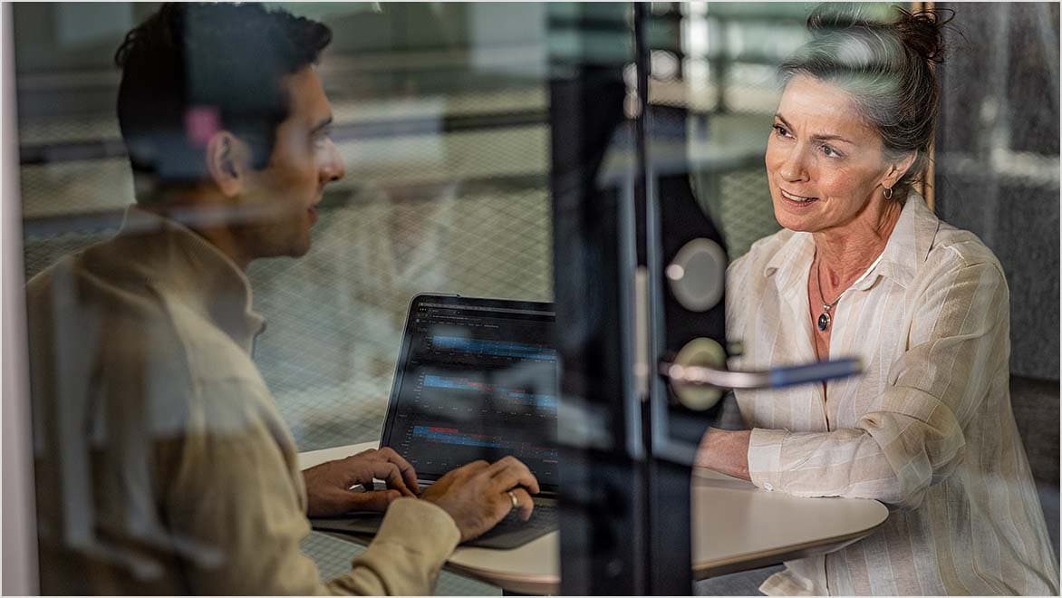 AECO professionals reviewing asset data in a conference room
