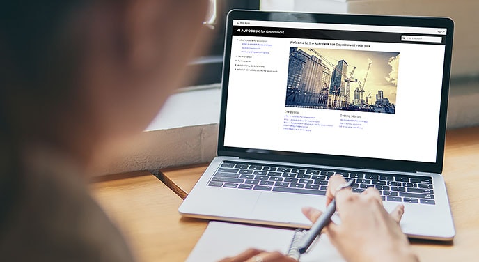 Laptop with screen showing Autodesk for Government user guide home page