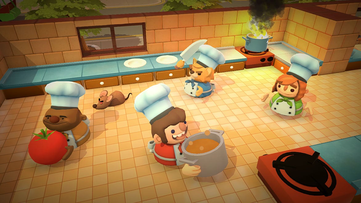 Karaktärer som lagar mat i spelet ”Overcooked”