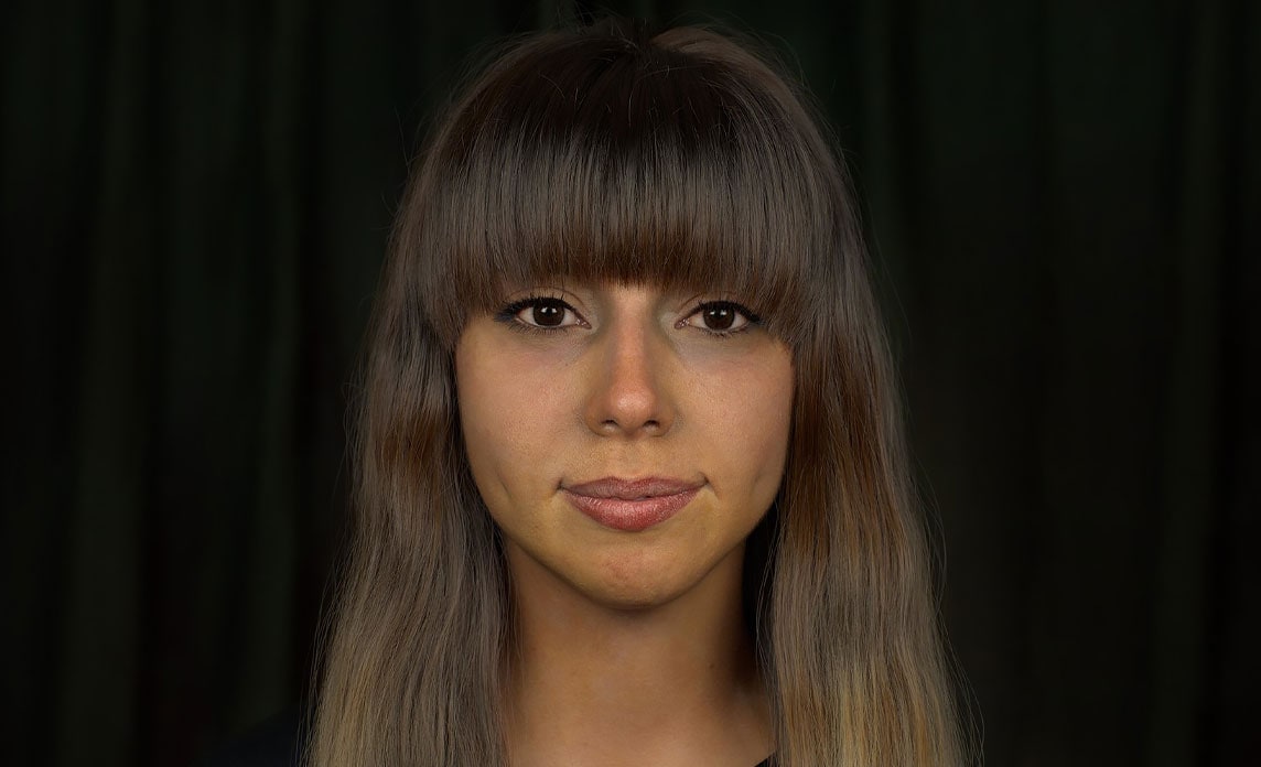 A woman's face, rendered in Maya.