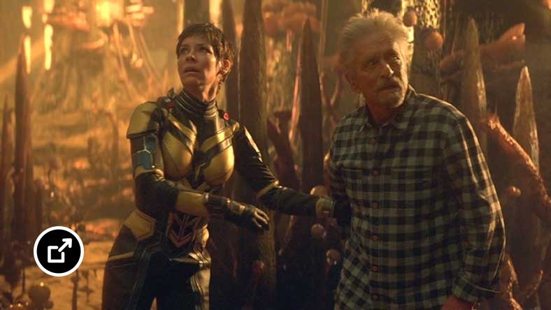 The Wasp and Dr. Hank Pym walking through the forest in Ant-Man and The Wasp: Quantumania. 