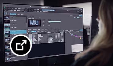 Woman looks at Flow Production Tracking on her monitor