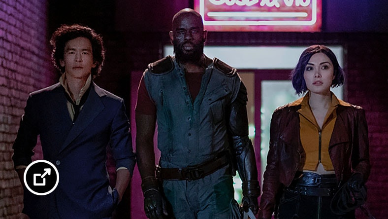 Three characters and a dog walk down a dark alley in Cowboy Bebop film