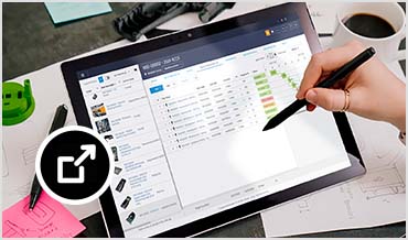 Overhead view shows Fusion Manage running on a tablet. 