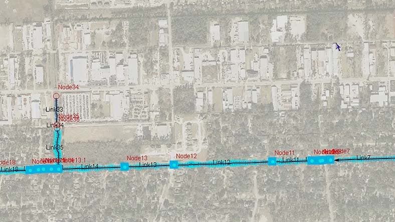 Aerial view of an environment with overlay showing the modeled sanitary sewer system