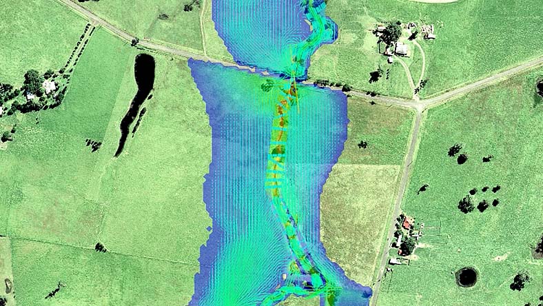 Aerial view of a river with overlaid data showing the impacts of flooding on the area