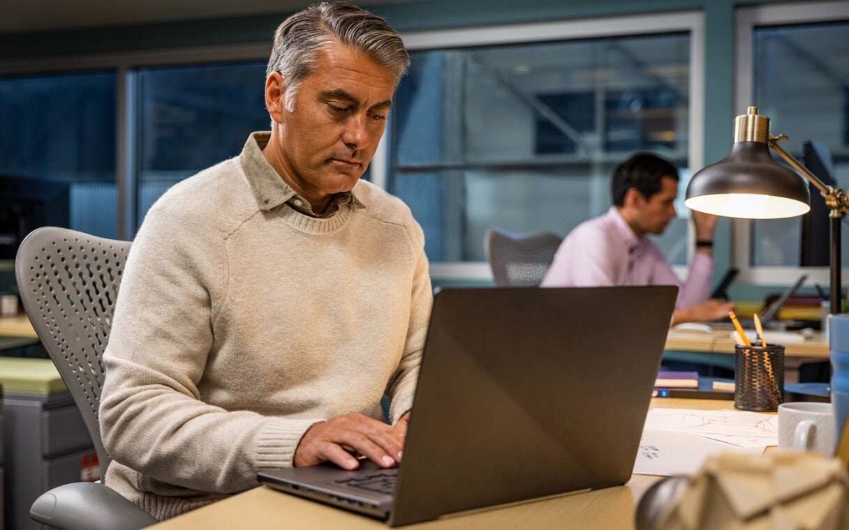 Employee working on design authoring on a laptop