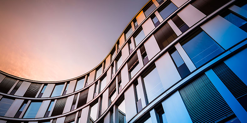 Glass facade of a modern office building in Hamburg, Germany.