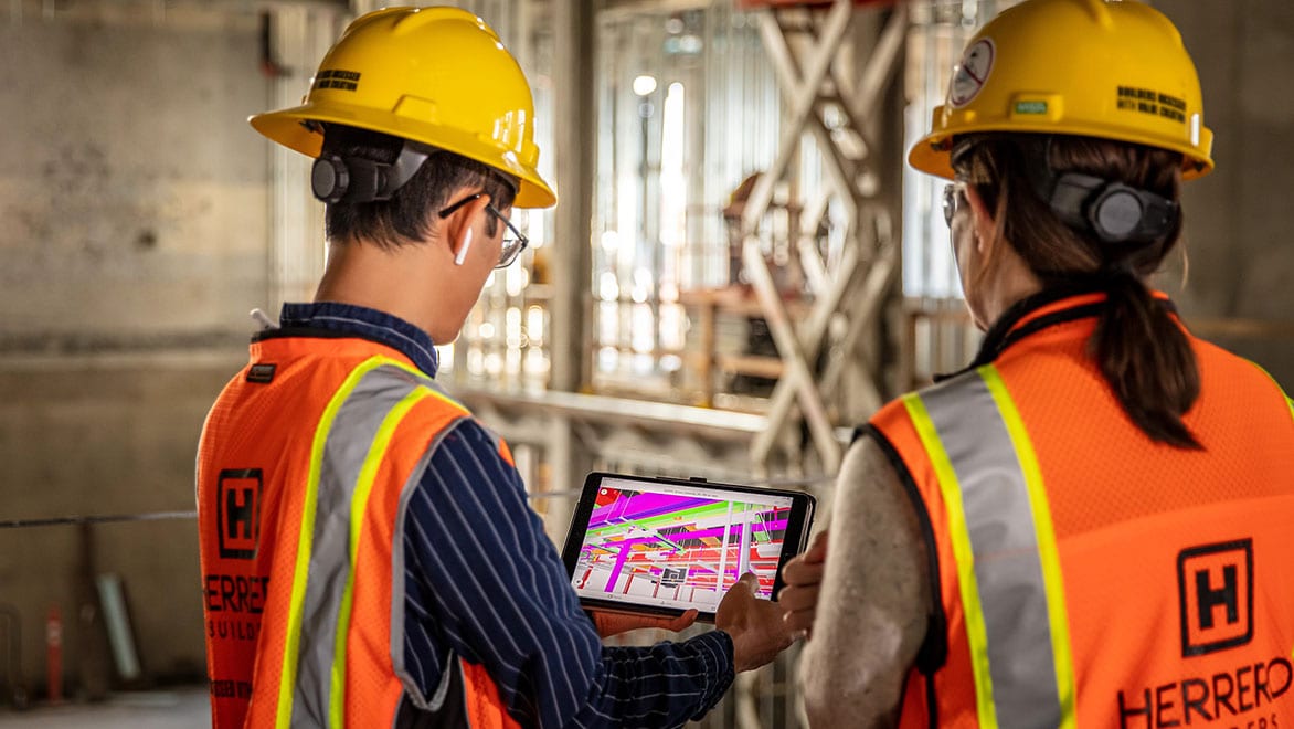 General contractors verify on-site work against a Navisworks construction coordination model on a tablet