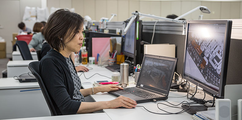 Woman using software on a computer in an office environment