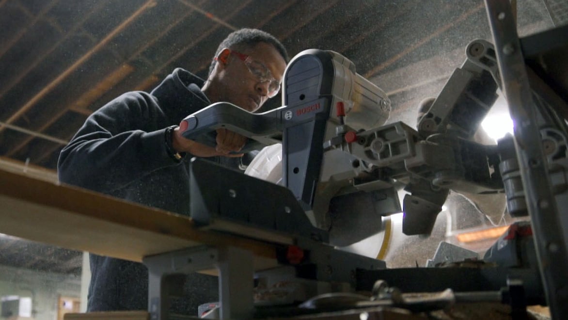 Man works with a saw